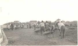 Men paving South Railway Street