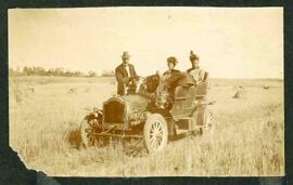 Eli Williamson with two women passengers in Russell car