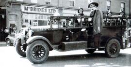 Firemen on fire truck in Indian Head parade