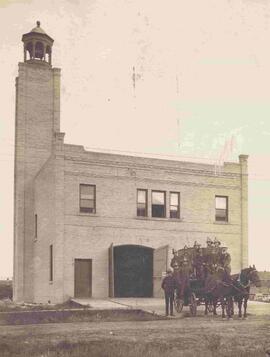 Indian Head Fire Hall with horses and fire crew posing in front