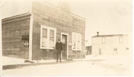 A man in front of the Pool Hall and Cafe - Beatty, Sask.