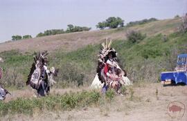 Two traditional dancers in procession