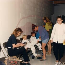 Young cast members getting dressed for performance