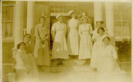 Nurses on hospital entrance stairs