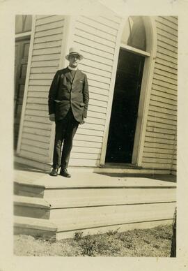 Rev. Benjamin Crowe standing on steps of Anglican Church