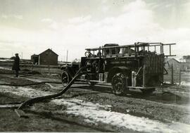 Fire truck with hose pumping water