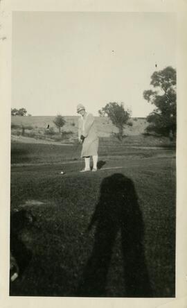 Woman playing golf