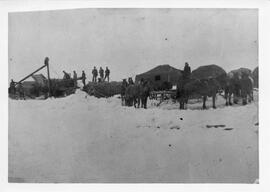 Threshing grain in the snow