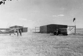 Airport Hangar and Plane