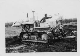 Man on caterpillar tractor