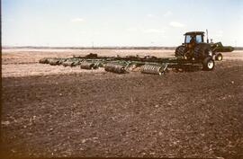 Tractor and harrow/packer drawbar