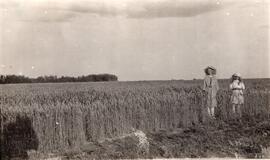 Two Girls Standing in a Field