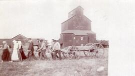 Men and Women Pulling a Wagon