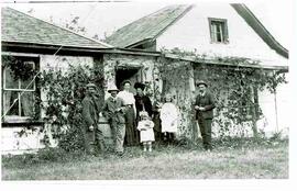 Photo series of Couper family in front of home.